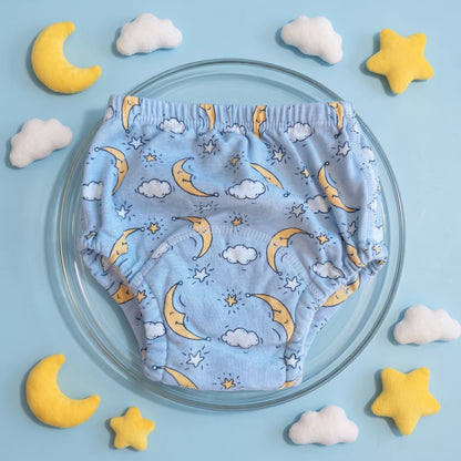 Braguita de aprendizaje Milhen azul claro con estampado de lunas y nubes